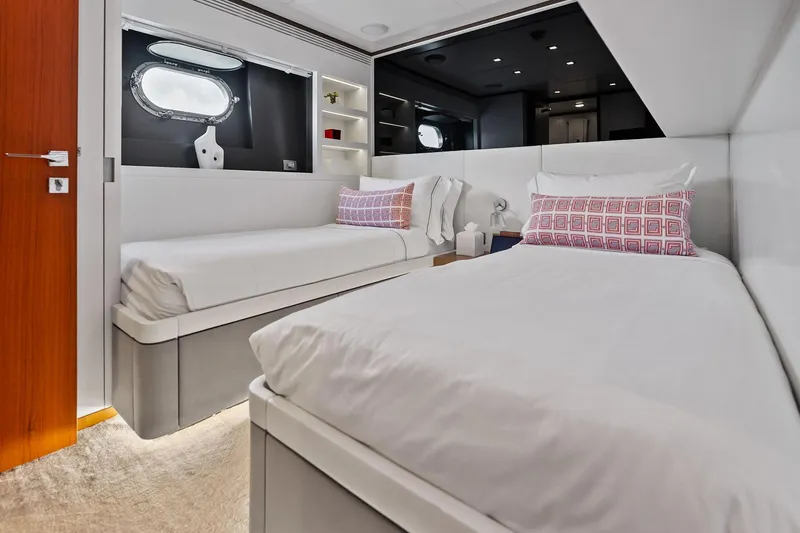 Slide: The Image of Luxurious twin bedroom on 2013 AB 116 Motoryacht with modern decor and porthole window. - 69