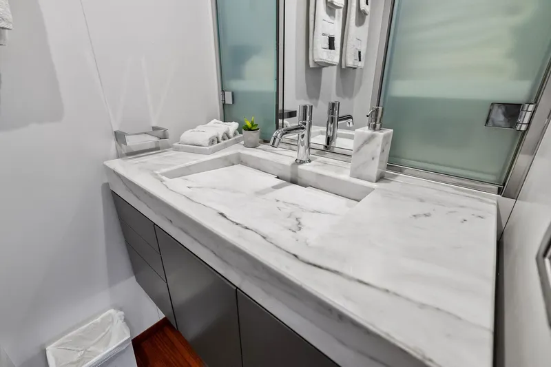Slide: The Image of Luxurious marble bathroom sink on 2013 AB 116 Motoryacht, featuring modern fixtures and elegant design. - 73