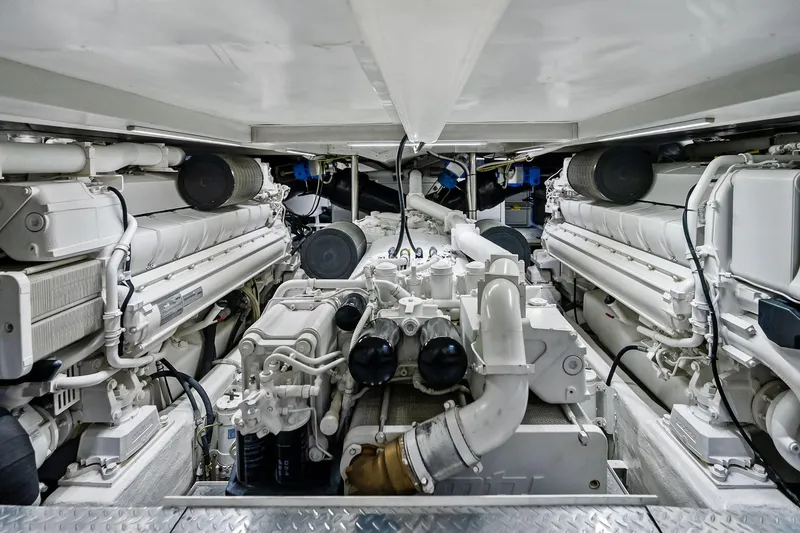 Slide: The Image of Engine room of 2013 AB 116 Motoryacht, showcasing dual engines and mechanical components. - 75