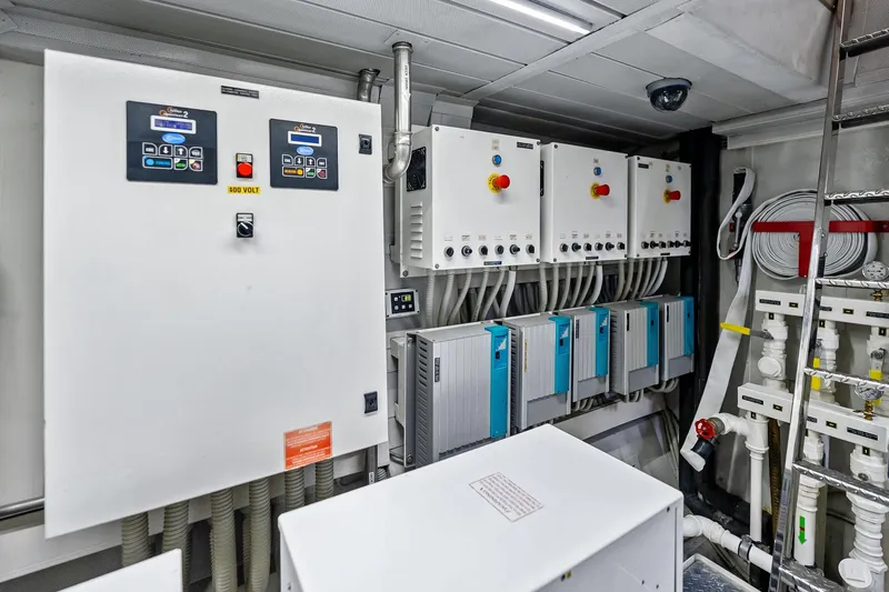 Slide: The Image of Electrical control room of 2013 AB 116 Motoryacht, featuring panels and wiring systems. - 81