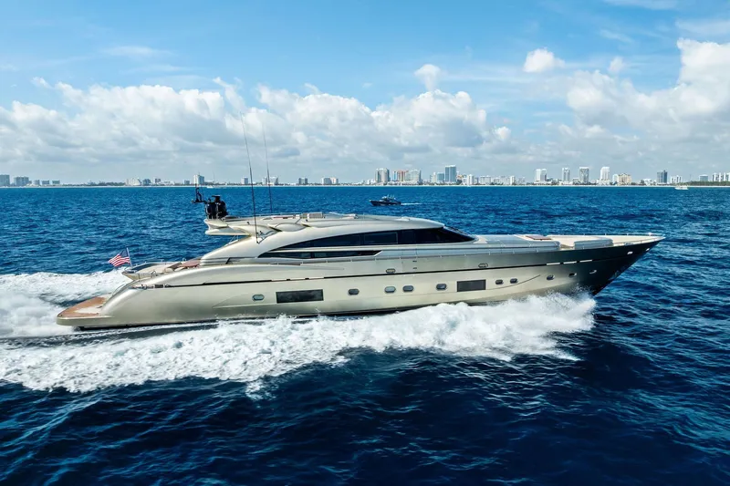 Slide: The Image of Luxurious 2013 AB 116 Motoryacht cruising on open sea with city skyline backdrop. - 88