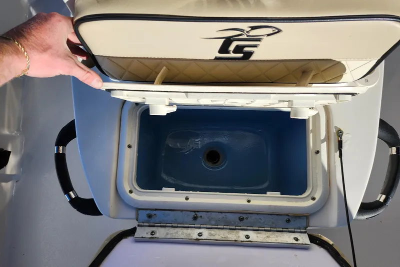 Slide: The Image of 2020 Carolina Skiff 162 JLS boat seat with built-in storage compartment open. - 15