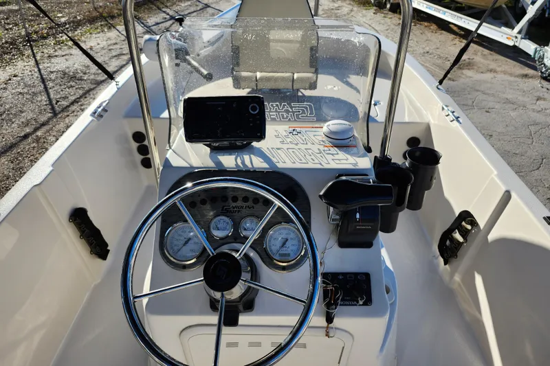 Slide: The Image of 2020 Carolina Skiff 162 JLS boat console with steering wheel and gauges. - 20