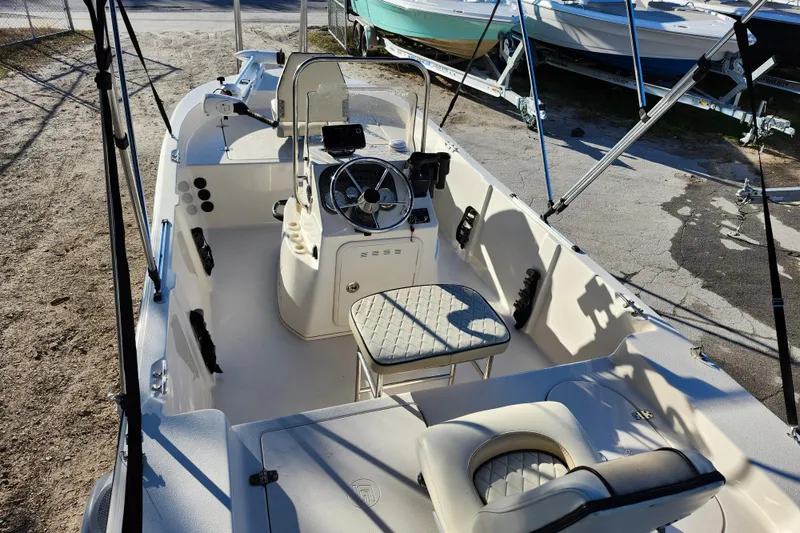 Slide: The Image of 2020 Carolina Skiff 162 JLS boat interior with steering console and seating. - 23