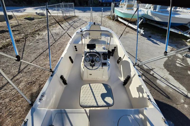 Slide: The Image of 2020 Carolina Skiff 162 JLS boat interior with steering console and seating. - 24