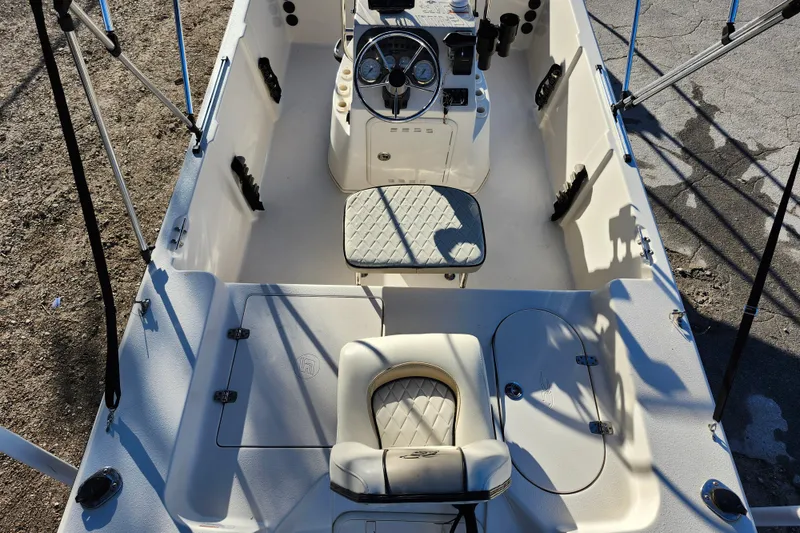 Slide: The Image of 2020 Carolina Skiff 162 JLS boat interior with steering console and seating. - 32