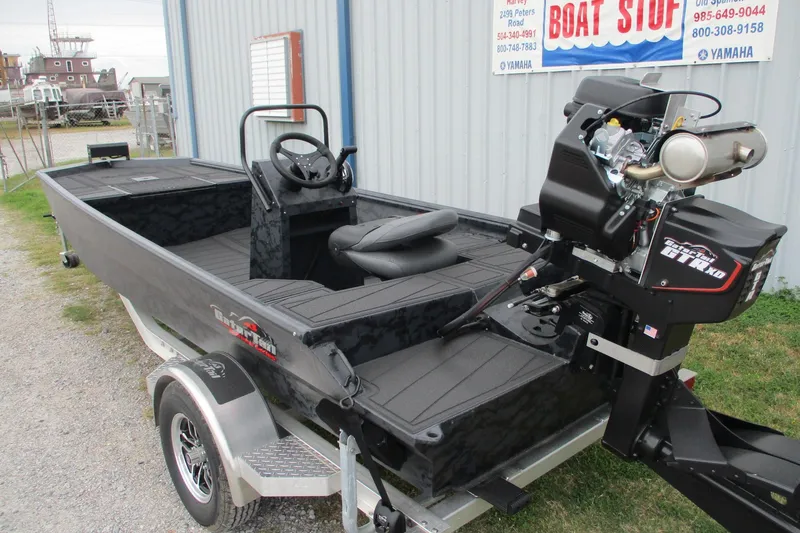 Slide: The Image of 2026 Gatortail 1860 EXTREME C.C. boat on trailer, parked outside a building. - 4