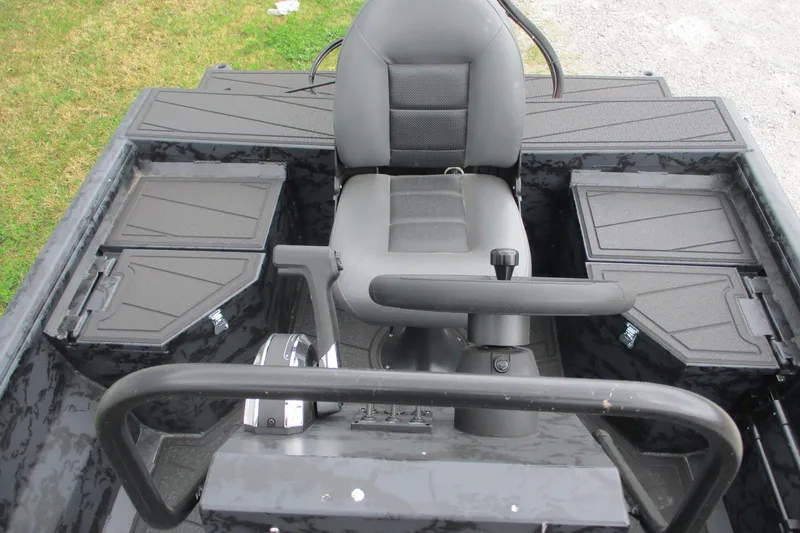 Slide: The Image of 2026 Gatortail 1860 EXTREME C.C. boat interior with central steering console and storage compartments. - 7