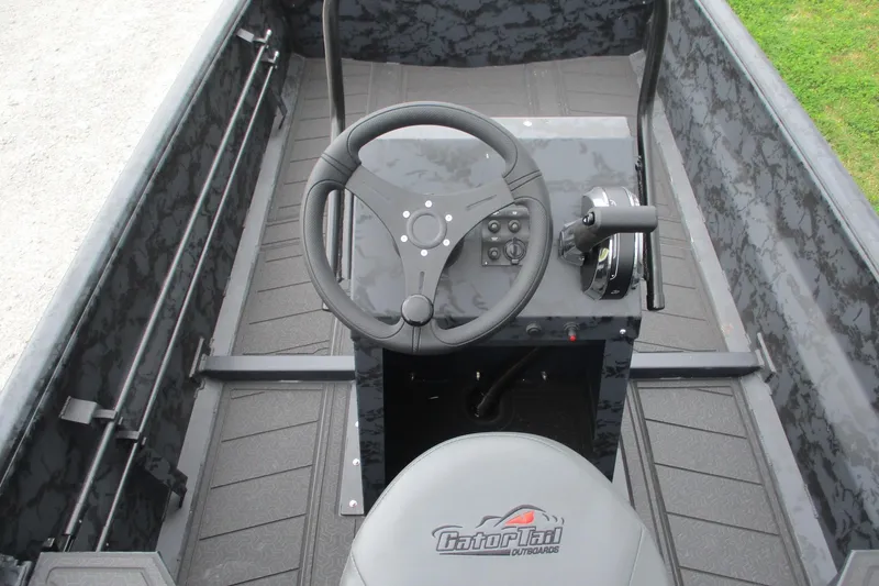 Slide: The Image of 2026 Gatortail 1860 EXTREME C.C. boat interior with steering console and seat. - 8