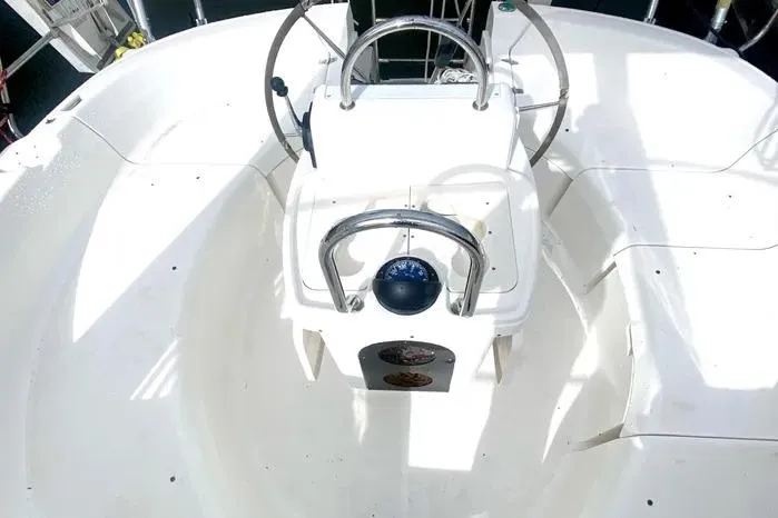 Slide: The Image of Cockpit of 1997 Hunter 430 sailboat with steering wheel and compass. - 21
