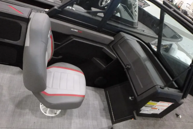 Slide: The Image of 2025 Alumacraft Trophy 185X Sport interior with gray and red seating. - 12