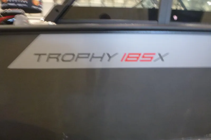 Slide: The Image of 2025 Alumacraft Trophy 185X Sport boat logo on side panel. - 17