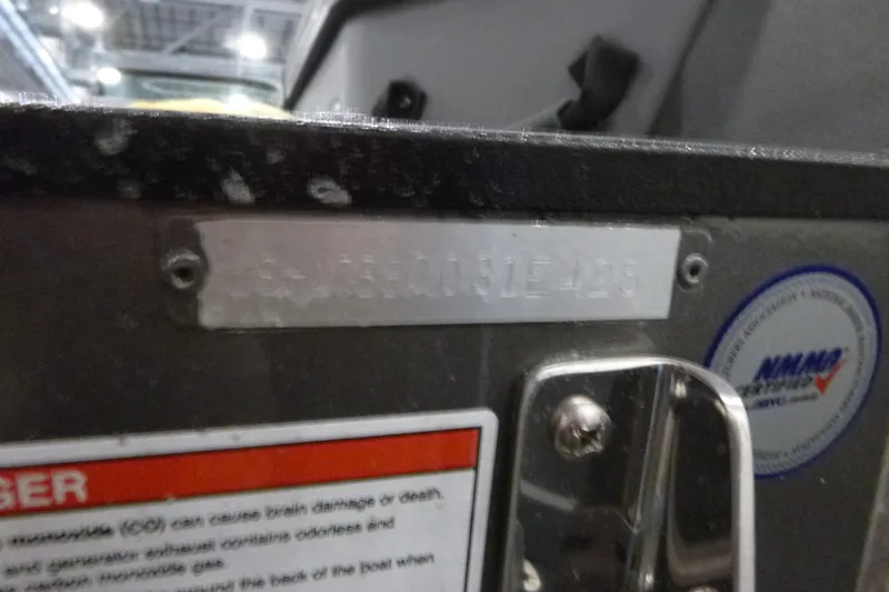 Slide: The Image of 2025 Alumacraft Trophy 185X Sport boat identification plate and warning label. - 18