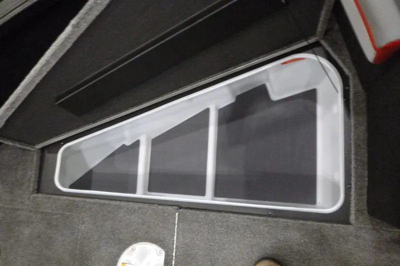 Slide: The Image of 2025 Alumacraft Trophy 185X Sport boat storage compartment, interior view. - 7