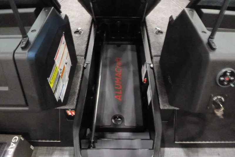 Slide: The Image of 2025 Alumacraft Trophy 185X Sport boat interior storage compartment. - 9