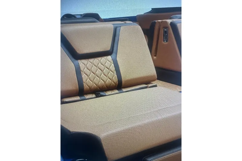 Slide: The Image of Luxurious seating in 2026 Yamaha Boats 255XD with elegant tan upholstery and black accents. - 3