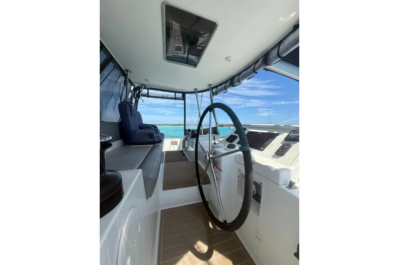 Slide: The Image of Interior view of 2016 Lagoon 450 F catamaran helm with ocean backdrop. - 16