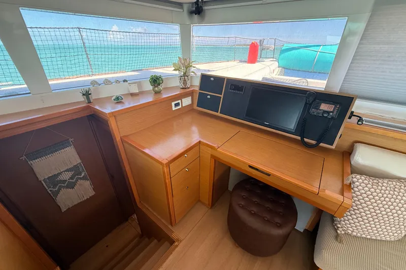 Slide: The Image of Interior of 2016 Lagoon 450 F yacht with navigation station and ocean view. - 22