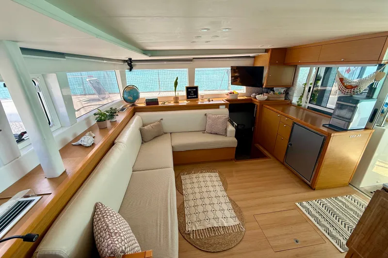 Slide: The Image of Interior of 2016 Lagoon 450 F catamaran with cozy seating and modern amenities. - 24