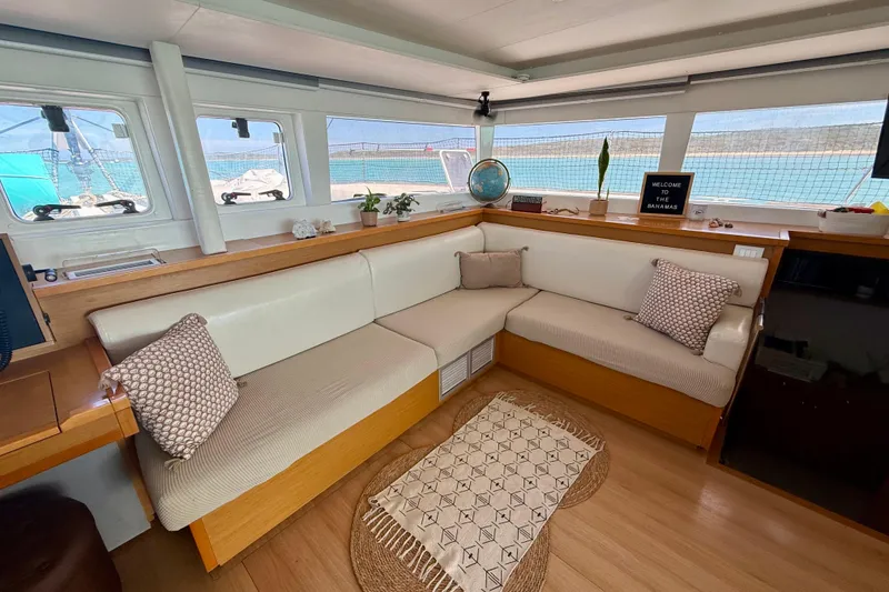 Slide: The Image of Interior of 2016 Lagoon 450 F catamaran with cozy seating and ocean view. - 25