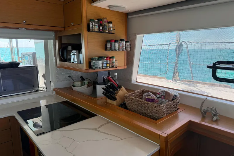 Slide: The Image of Modern kitchen interior on 2016 Lagoon 450 F catamaran with ocean view. - 29