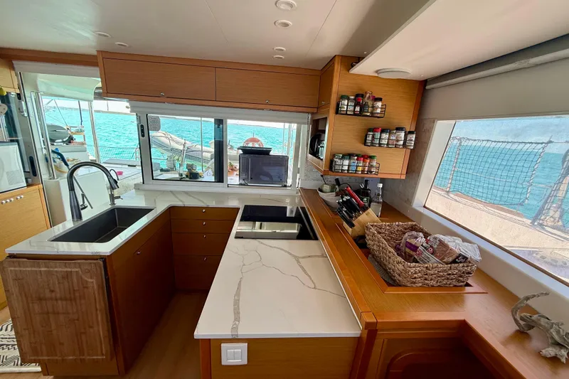 Slide: The Image of Modern kitchen interior of 2016 Lagoon 450 F catamaran with ocean view. - 30