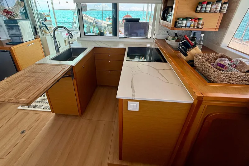 Slide: The Image of Modern kitchen interior on 2016 Lagoon 450 F yacht with ocean view. - 31