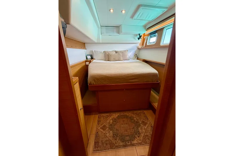 Slide: The Image of Cozy bedroom interior of 2016 Lagoon 450 F yacht with elegant wood finish. - 35
