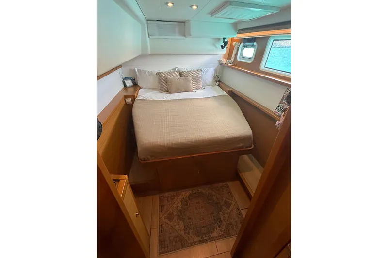 Slide: The Image of Cozy bedroom interior of 2016 Lagoon 450 F yacht with bed and window view. - 36
