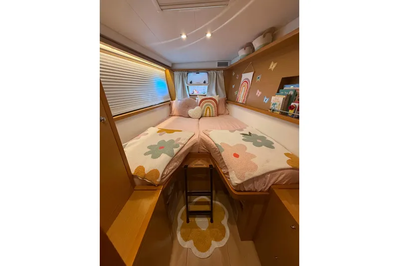 Slide: The Image of Cozy bedroom in 2016 Lagoon 450 F catamaran with floral decor and rainbow accents. - 37