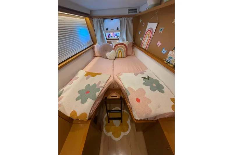 Slide: The Image of Cozy cabin interior of 2016 Lagoon 450 F with floral decor and rainbow accents. - 38