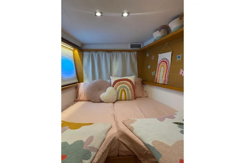 Slide: The Image of Cozy bedroom in 2016 Lagoon 450 F yacht with rainbow decor and soft lighting. - 39