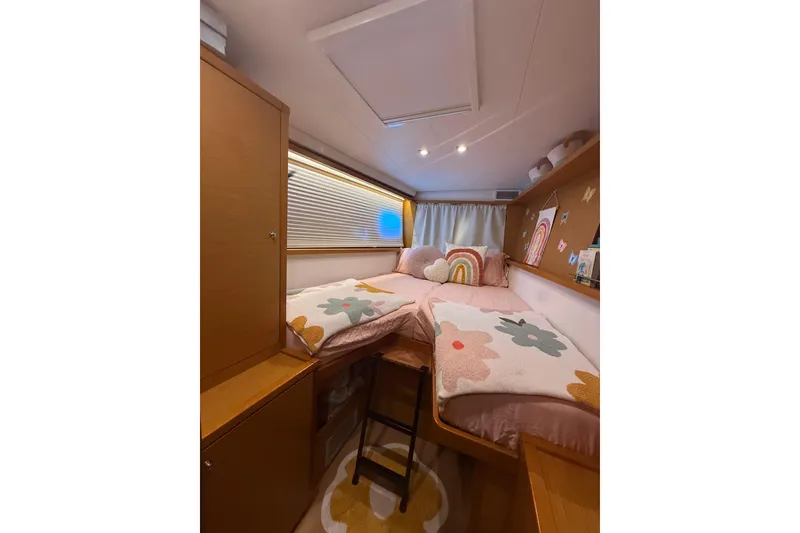Slide: The Image of Cozy cabin interior of 2016 Lagoon 450 F catamaran with twin beds and colorful decor. - 40