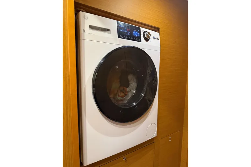 Slide: The Image of Front-loading washing machine in a wooden cabinet on a 2016 Lagoon 450 F yacht. - 41