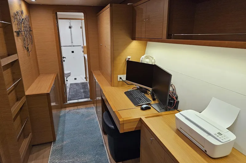 Slide: The Image of Modern office space inside a 2016 Lagoon 450 F yacht with desk, computer, and printer. - 44