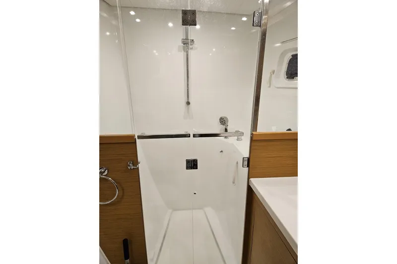Slide: The Image of Modern shower area in 2016 Lagoon 450 F yacht, featuring sleek design and glass door. - 45