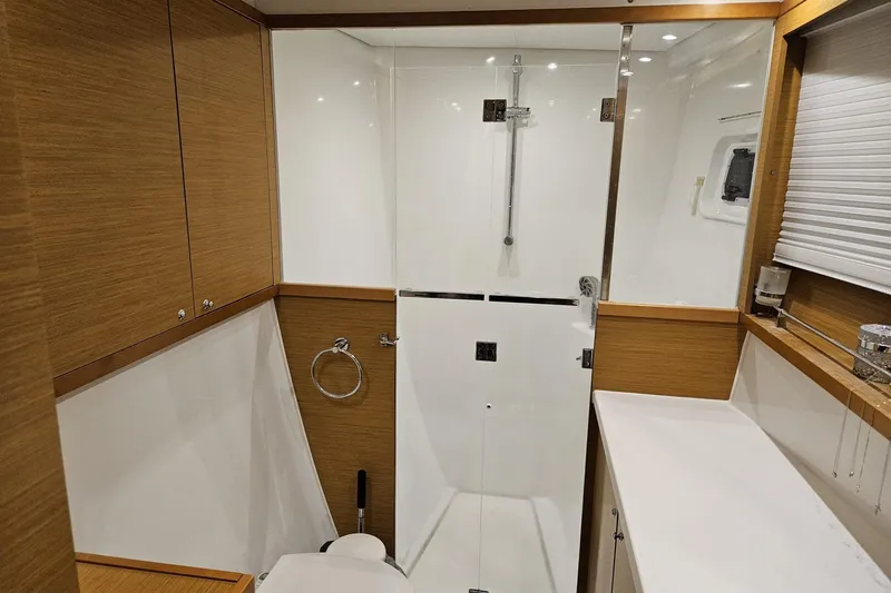 Slide: The Image of Luxurious bathroom interior of 2016 Lagoon 450 F yacht with modern shower and wood accents. - 46