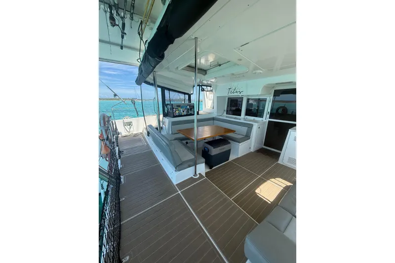 Slide: The Image of Spacious deck of 2016 Lagoon 450 F catamaran with seating and ocean view. - 8