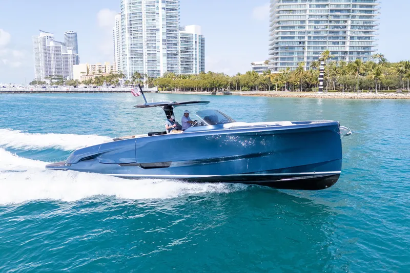 The Image of 2023 Solaris Power 44 Open yacht cruising near city skyline. - 0