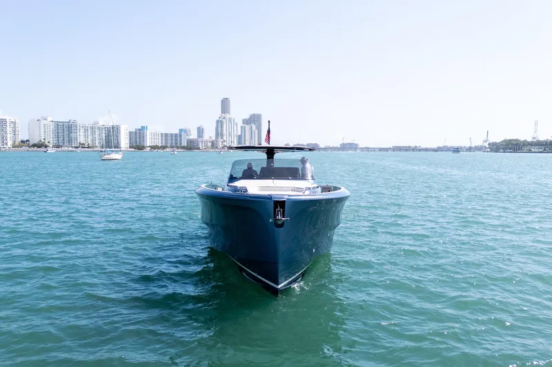 Slide: The Image of 2023 Solaris Power 44 Open yacht cruising near city skyline on a sunny day. - 10