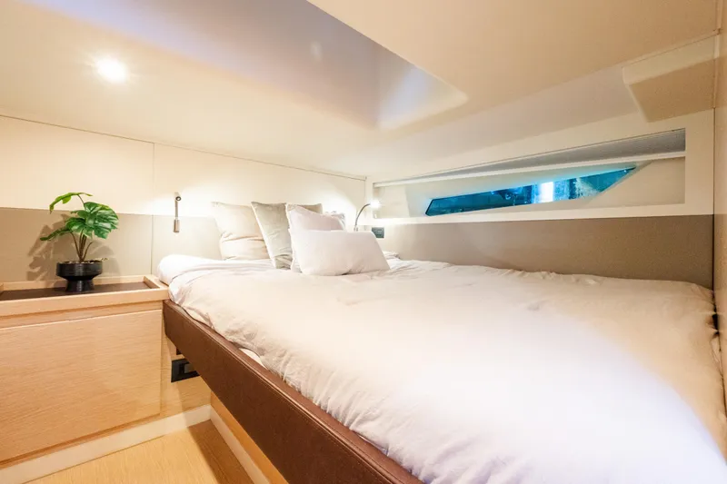 Slide: The Image of Luxurious cabin interior of 2023 Solaris Power 44 Open yacht with cozy bed and modern decor. - 100