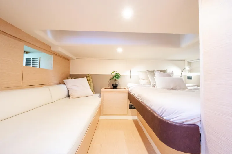 Slide: The Image of Luxurious interior cabin of 2023 Solaris Power 44 Open yacht, featuring elegant bedding and modern design. - 101