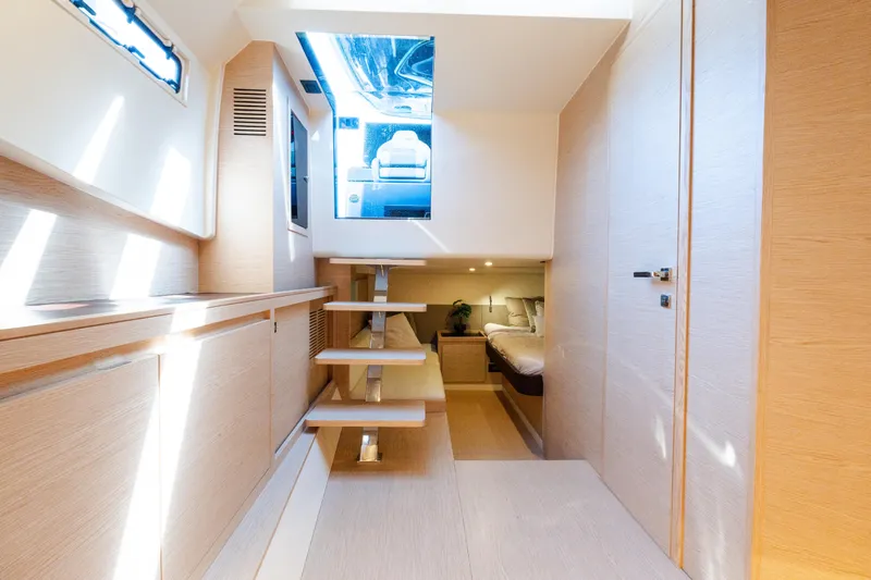 Slide: The Image of Interior of 2023 Solaris Power 44 Open yacht, featuring modern design and cozy cabin space. - 105