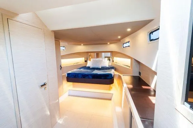 Slide: The Image of Luxurious interior cabin of 2023 Solaris Power 44 Open yacht, featuring modern design and cozy bedding. - 108