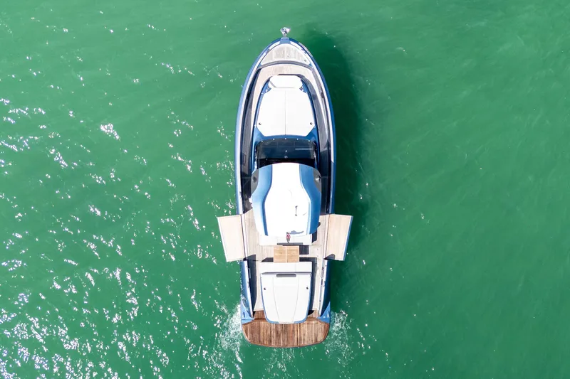 Slide: The Image of Aerial view of 2023 Solaris Power 44 Open yacht on turquoise water. - 13