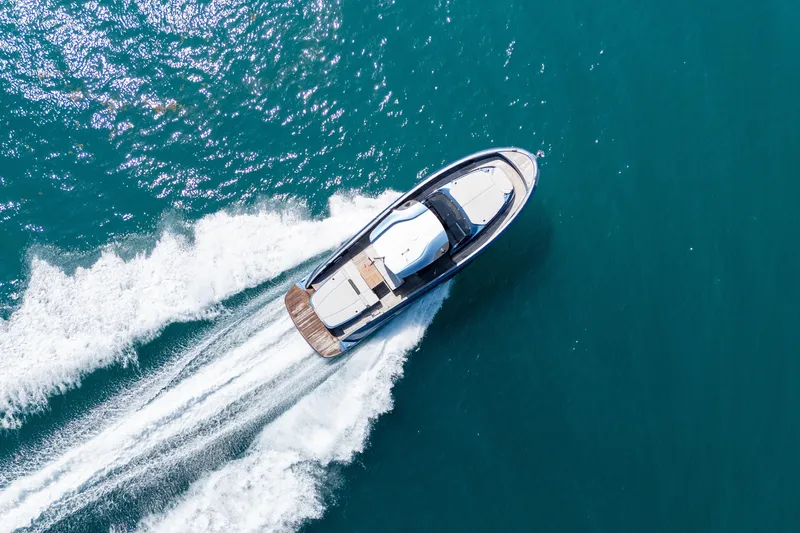 Slide: The Image of 2023 Solaris Power 44 Open yacht cruising on clear blue water. - 15