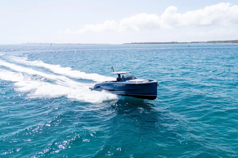 Slide: The Image of 2023 Solaris Power 44 Open yacht cruising on clear blue ocean waters. - 17