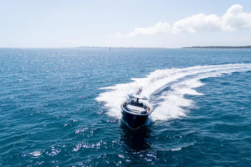 Slide: The Image of 2023 Solaris Power 44 Open yacht cruising on open blue sea. - 20