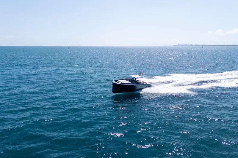 Slide: The Image of 2023 Solaris Power 44 Open yacht cruising on open sea under clear blue sky. - 21