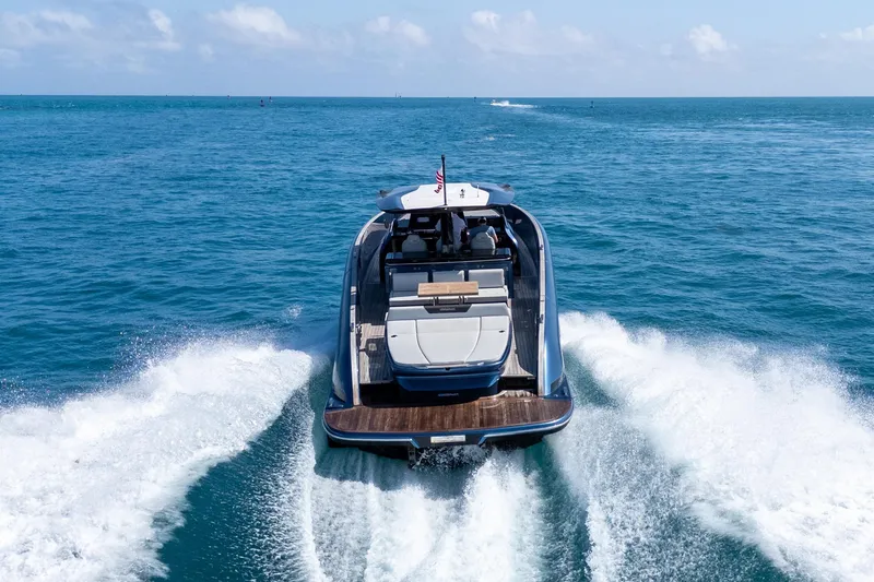 Slide: The Image of 2023 Solaris Power 44 Open yacht cruising on open sea, rear view. - 26